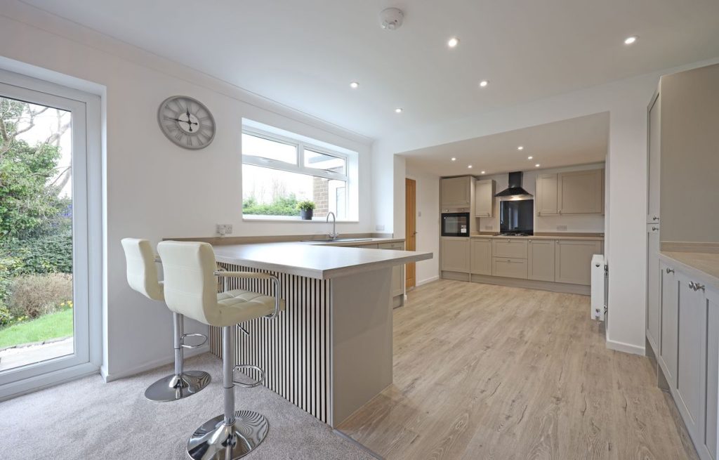 Open plan living space within a single-story, dark brick detached bungalow on Waveney Grove